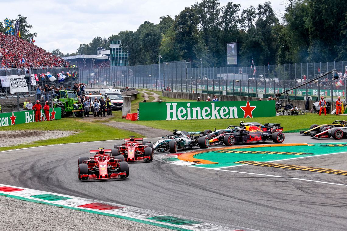 Some F1 cars take a corner at the Monza circuit