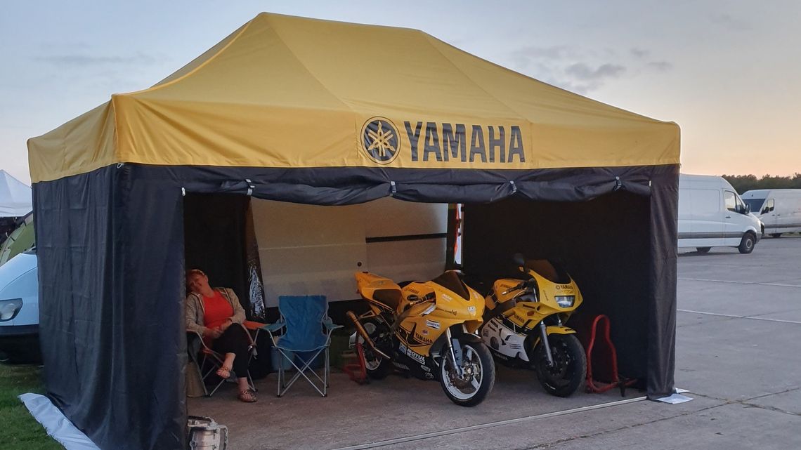 A 3m x 4.5m track day tent with motorcycles beneath it