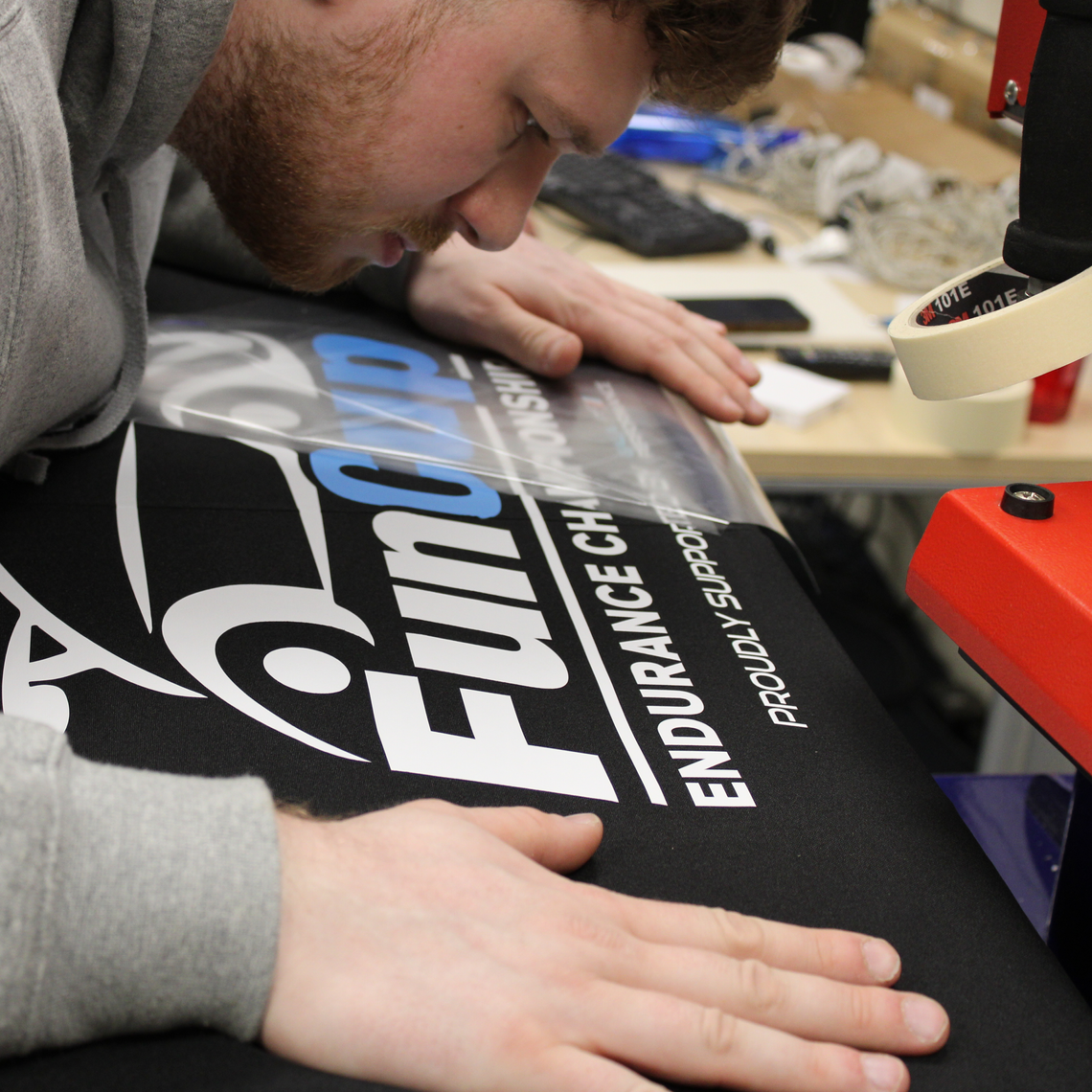 A man prepares a printed gazebo canopy