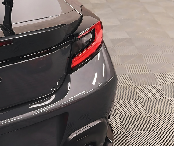 rear quarter detail dark grey sports car