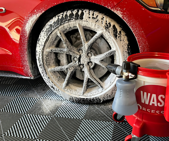 red sports car snow foam wheel cleaning